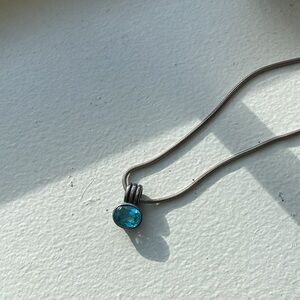 Sterling silver necklace with blue gemstone